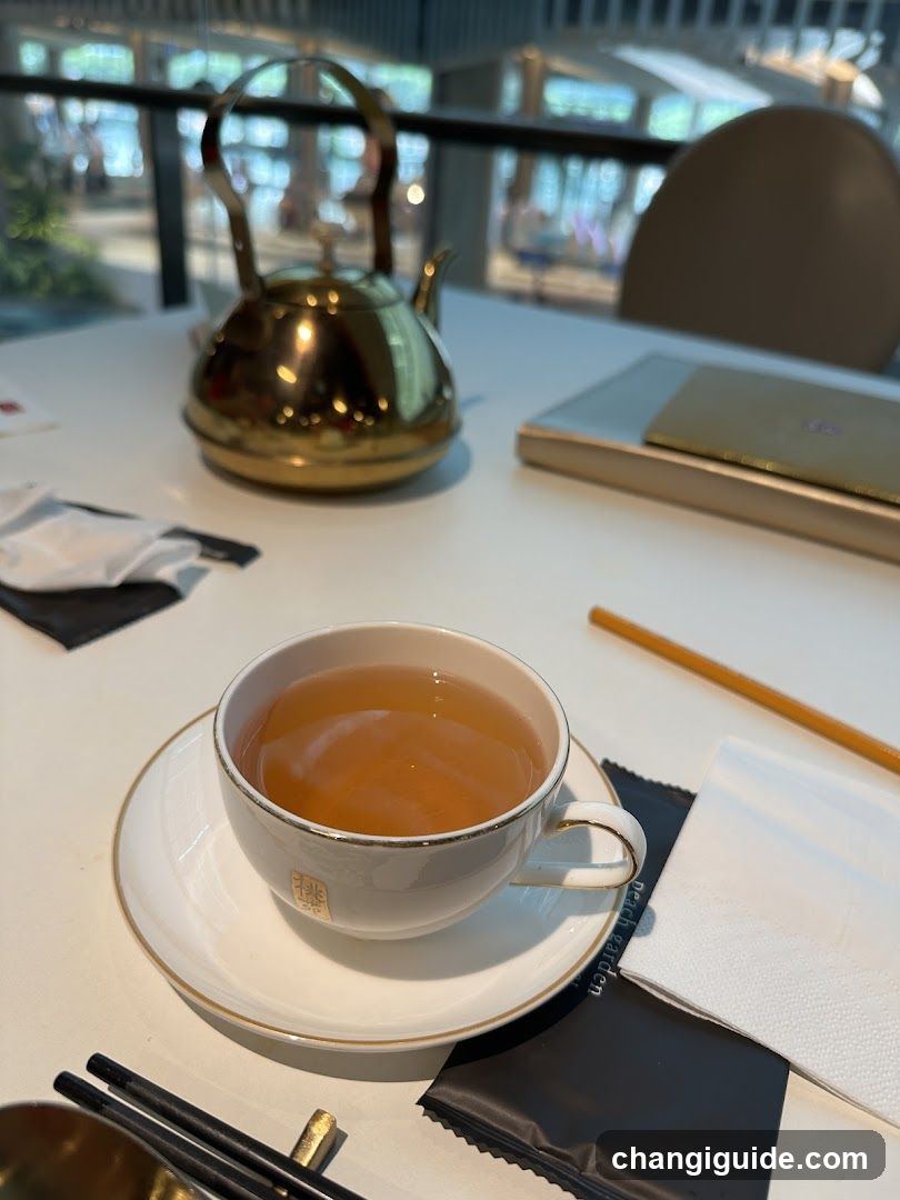 Tea Cup and Teapot on Table