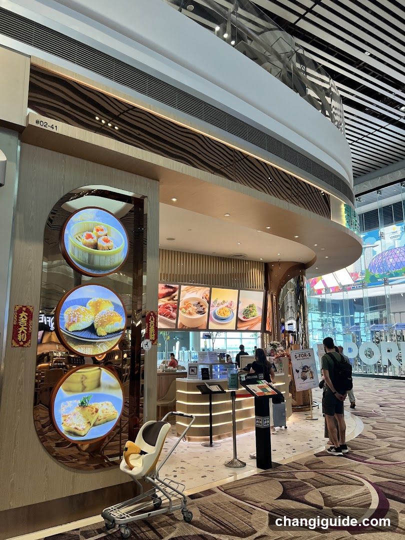 Food Court Interior with Display Screens and Counter