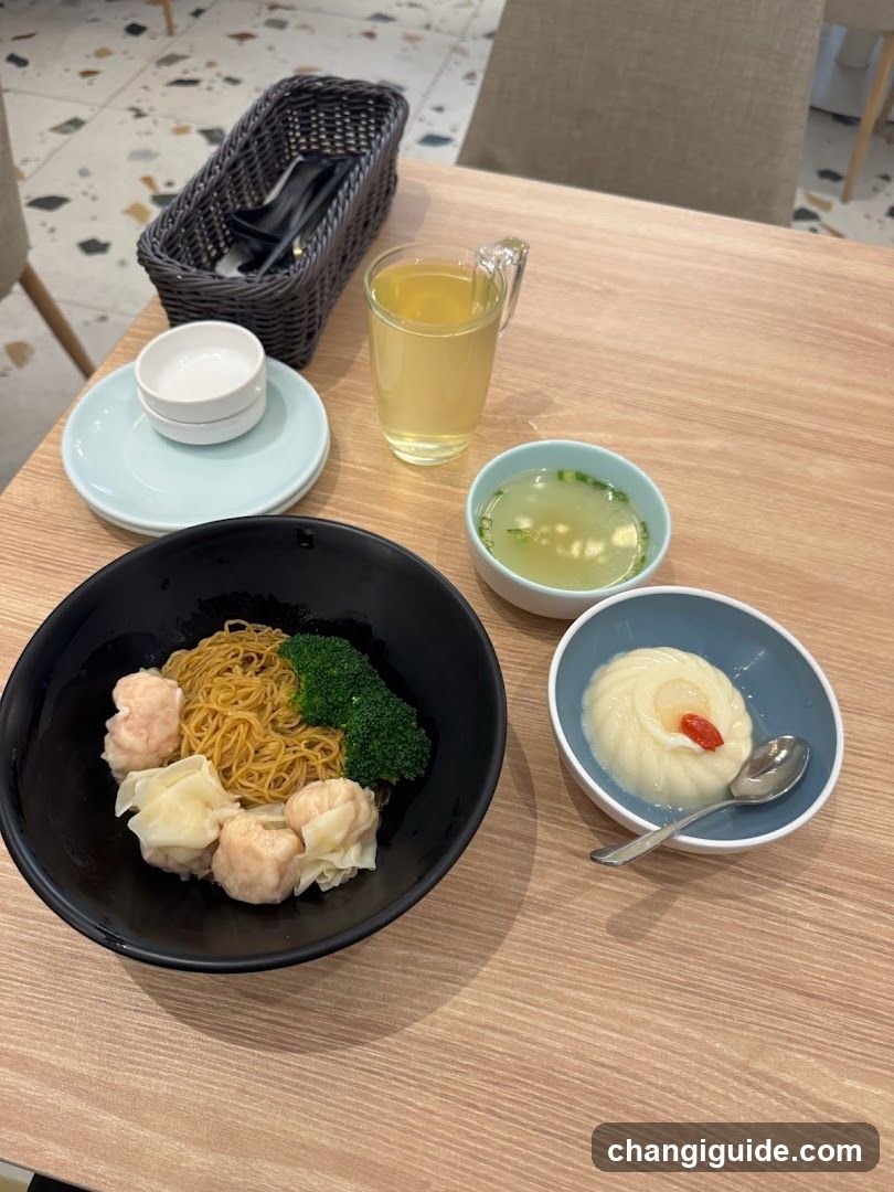 Dining Table with Noodles and Side Dishes