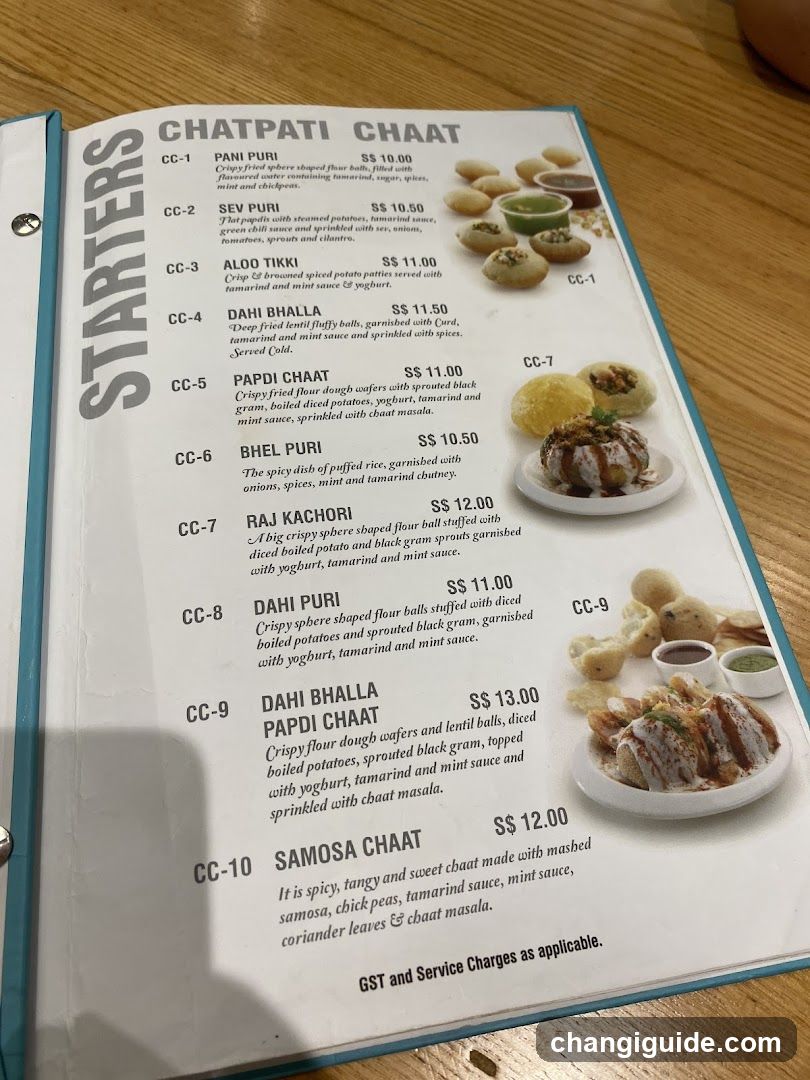 A printed menu page featuring a list of Indian chaat dishes with descriptions and prices.