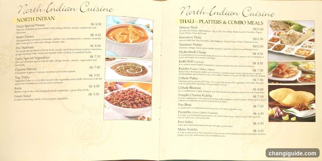A printed menu showcasing North Indian dishes, including Paneer, Dal Makhani, and various curries with prices listed.