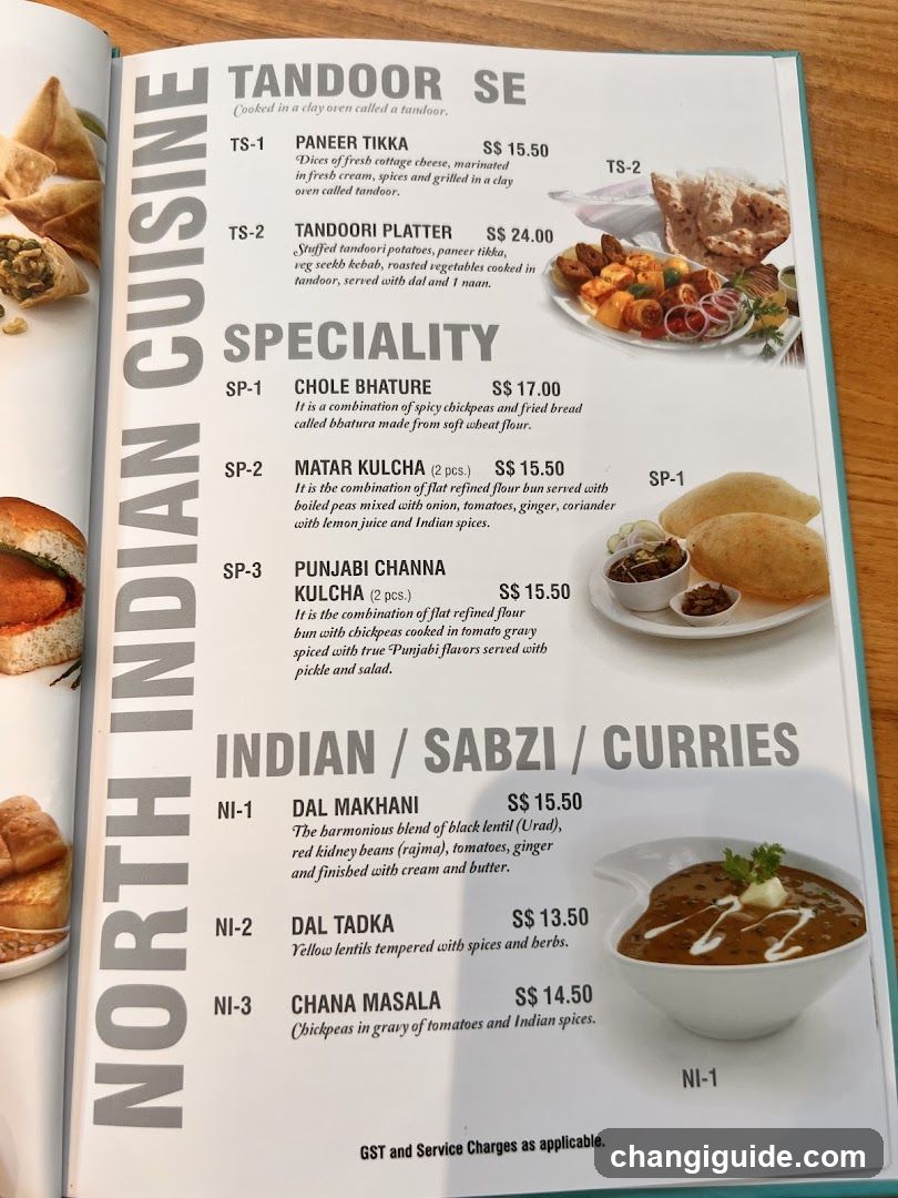 A printed menu page showcasing North Indian dishes, including Tandoor SE, Specialty items like Chole Bhature and Matar Kulcha, and Indian/Sabzi/Curries such as Dal Makhani.