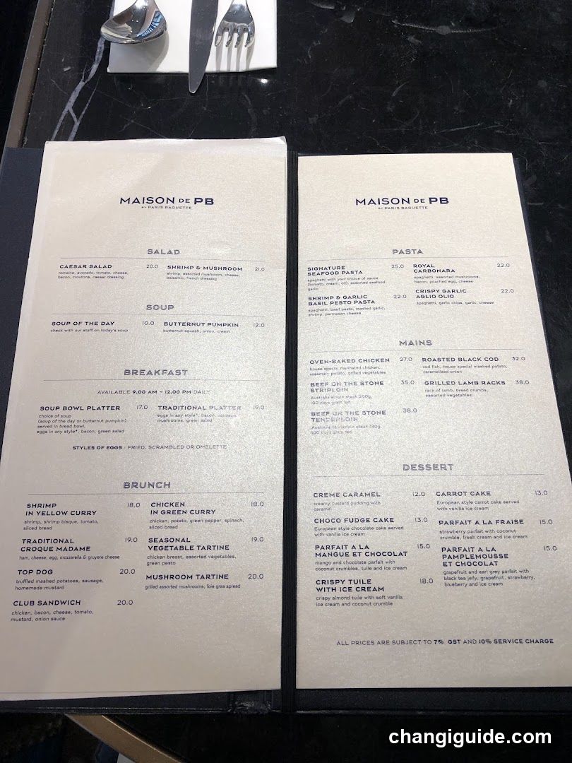 A printed menu from Maison du PB restaurant, featuring sections for Salad, Soup, Breakfast, Brunch, Pasta, Mains, and Dessert.