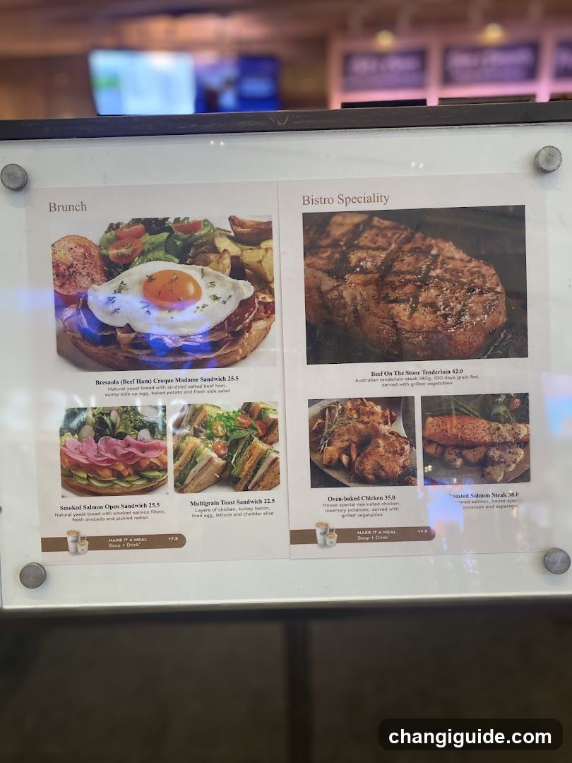 A framed menu board displaying brunch and bistro specialty items with photos, descriptions, prices, and a 'Make it a Meal' option.