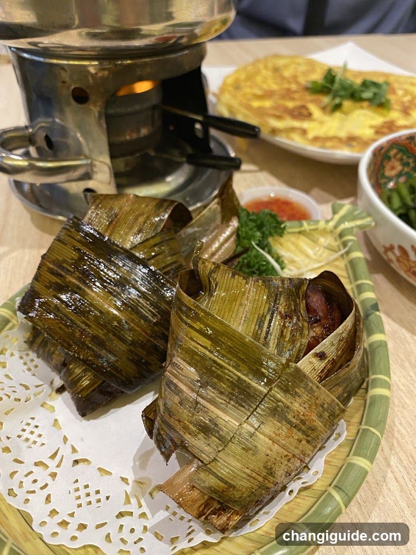Bamboo-wrapped food dish with side dishes and cooking setup
