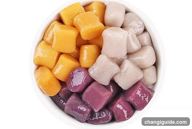 Bowl of colorful tapioca pearls and mango cubes