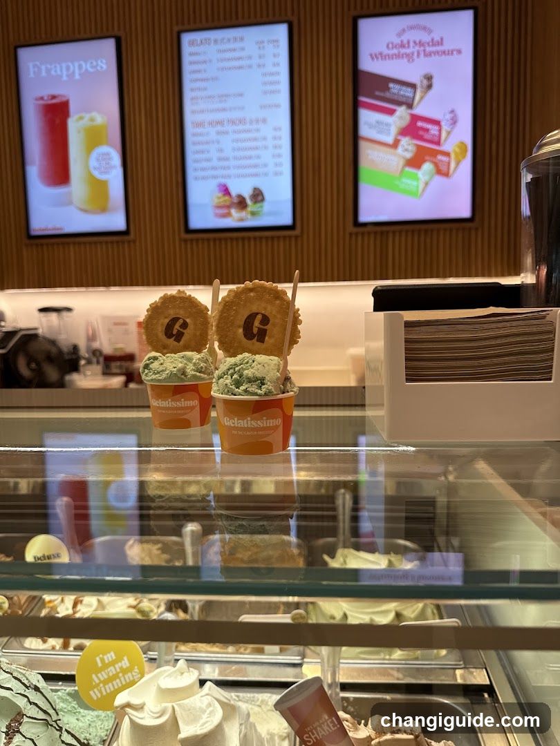 Gelato display with branded cups and menu boards