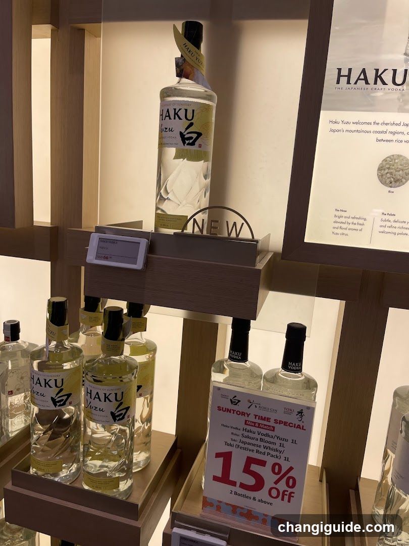 A wooden display shelf showcasing bottles of Haku Vodka, a Japanese craft vodka. The top shelf features a single bottle with a 'NEW' sign nearby. Below, multiple bottles are arranged on lower shelves. A promotional sign advertises a 15% off deal for Suntory Time Special, including Haku Vodka/Nuzu and Sakura Blom Whisky.