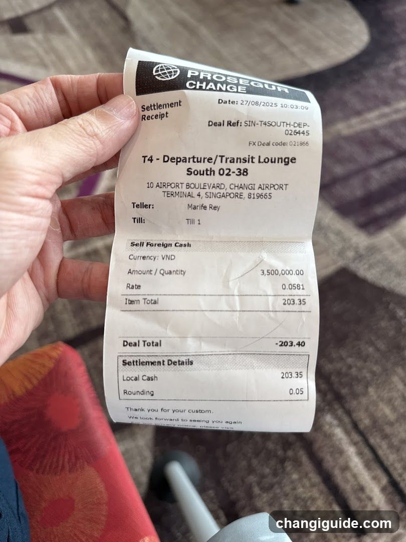 A close-up photo of a receipt from Prosecur Change, showing a transaction at T4 Departure/Transit Lounge South 02-38 in Changi Airport Terminal 4. The receipt details a self-foreign cash exchange involving 3,500,000 VND converted to SGD at a rate of 0.0591, resulting in an item total of 203.35 SGD with rounding adjustments.