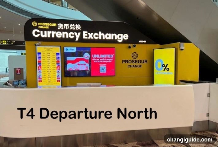 A currency exchange counter with a yellow and black sign displaying 'PROSEGUR CHANGE' and 'Currency Exchange'. The counter features multiple screens showing exchange rates and advertisements, including one promoting an unlimited service. A prominent sign below reads 'T4 Departure North', indicating the location within an airport terminal.