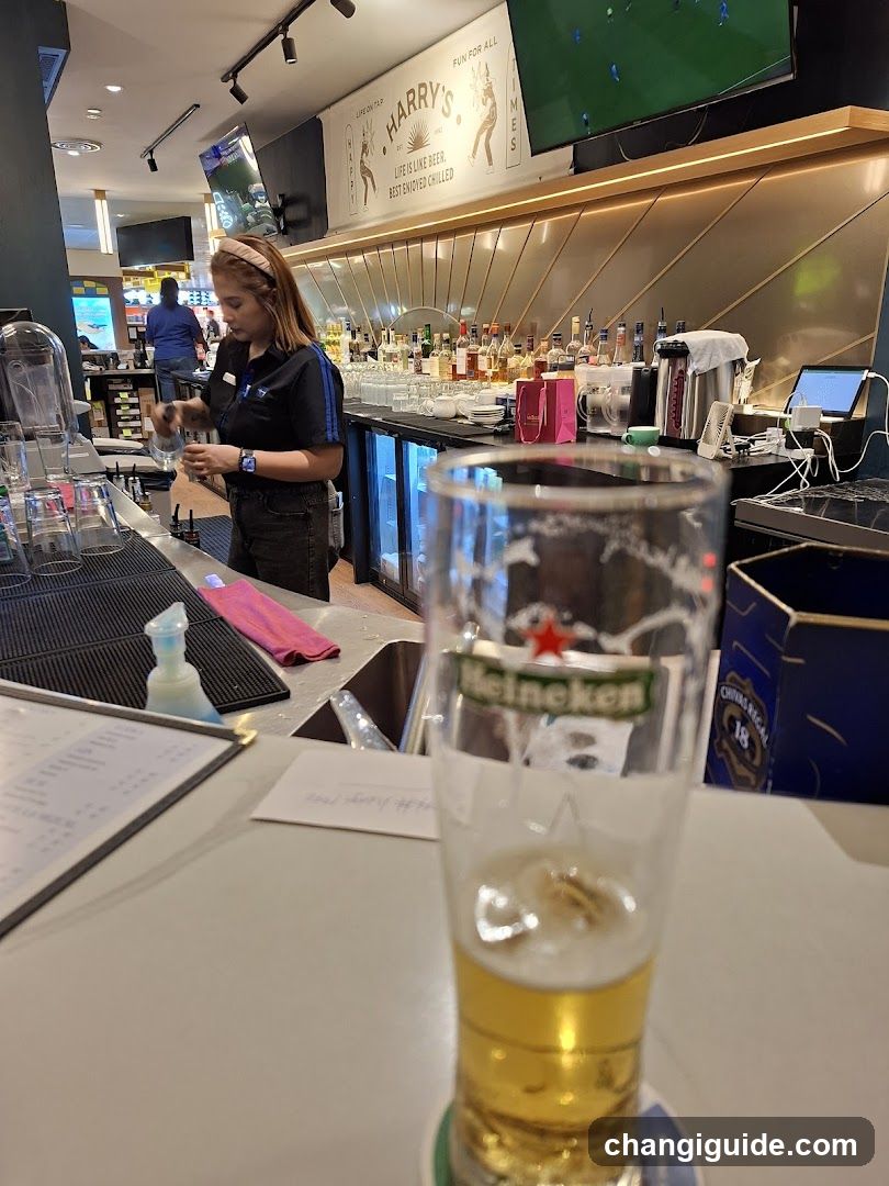 Bar Interior with Beer Glass in Foreground
