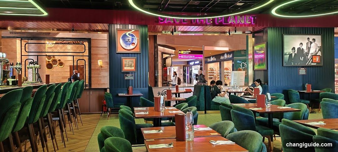 Restaurant Interior with Green Velvet Seating and Bar Area