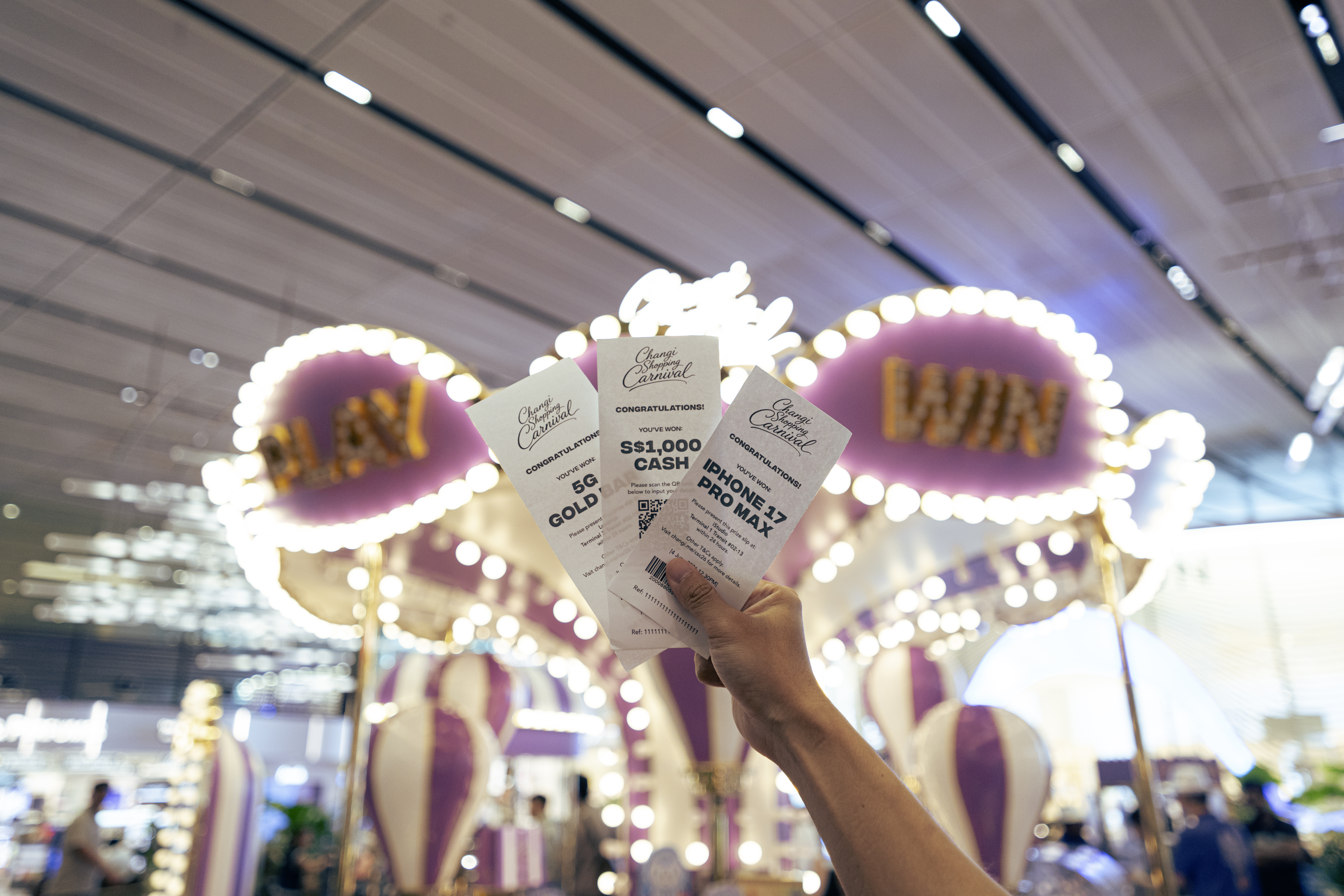 Be a winner signage at a Changi Shopping Carnival 2026 game kiosk with prize redemption slip
